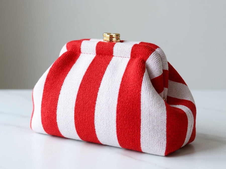 Bold stripes. Gold clasp. Zero apologies. 